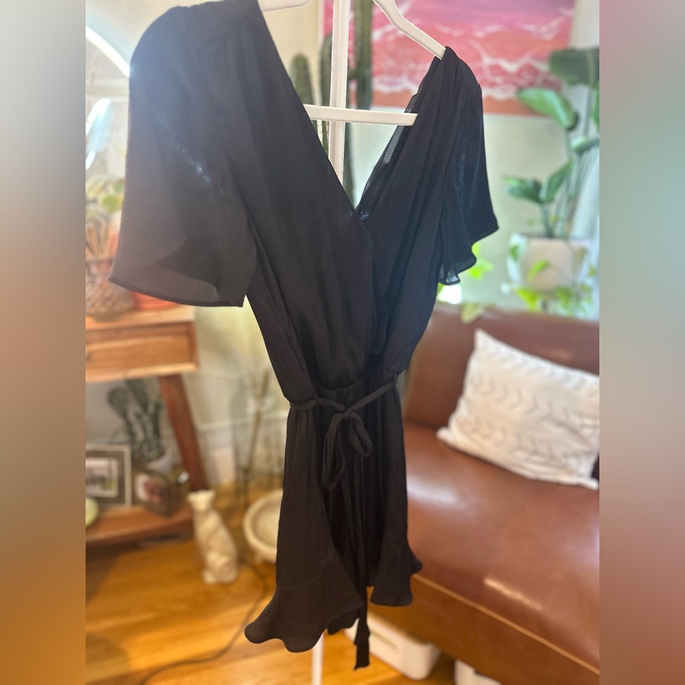 Super cute no name romper with flare detail - very flattering